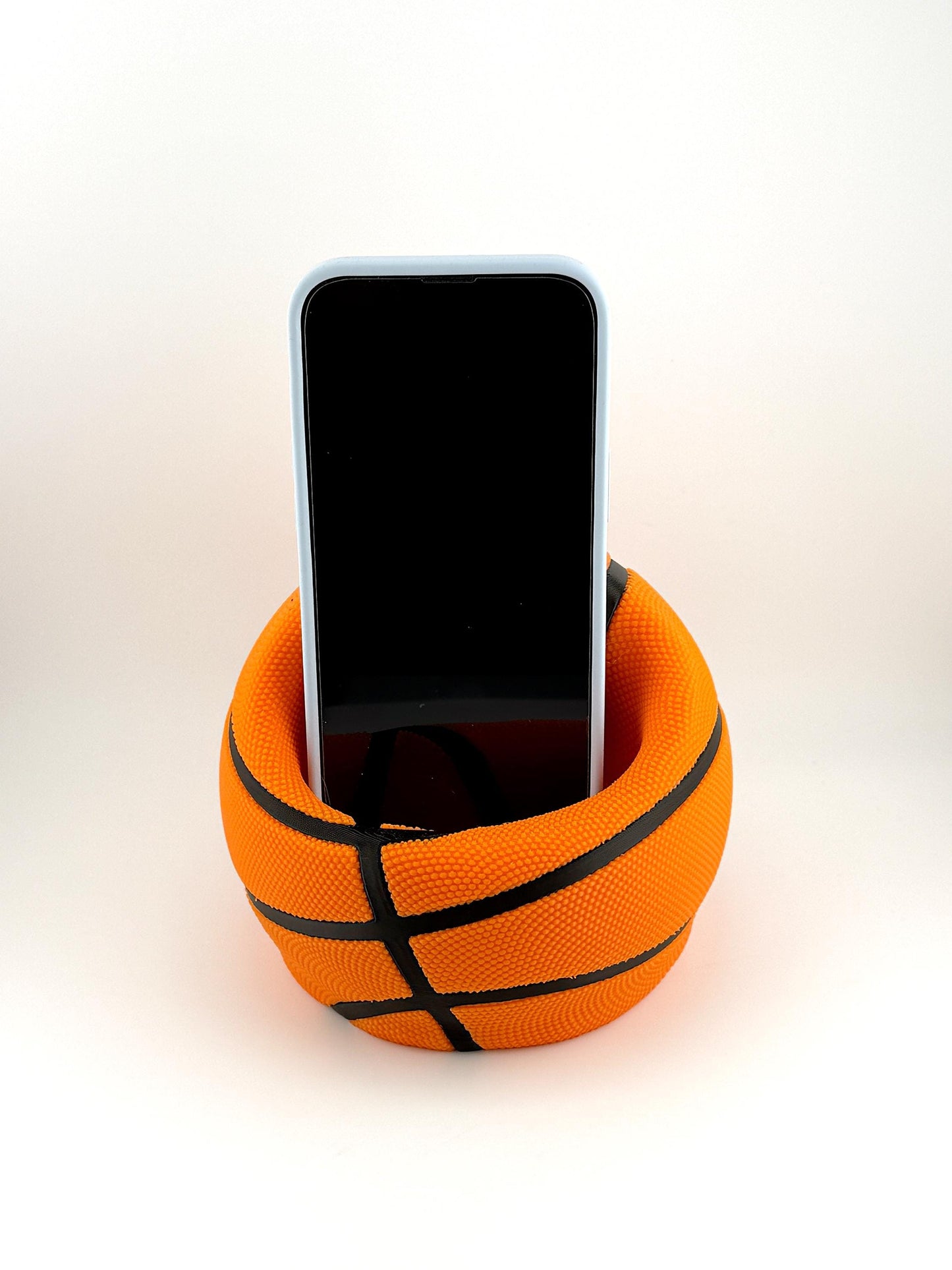 Basketball Slam Dunk Phone Holder and Charging Stand with Black Seams and Hidden Charging Cord Holder