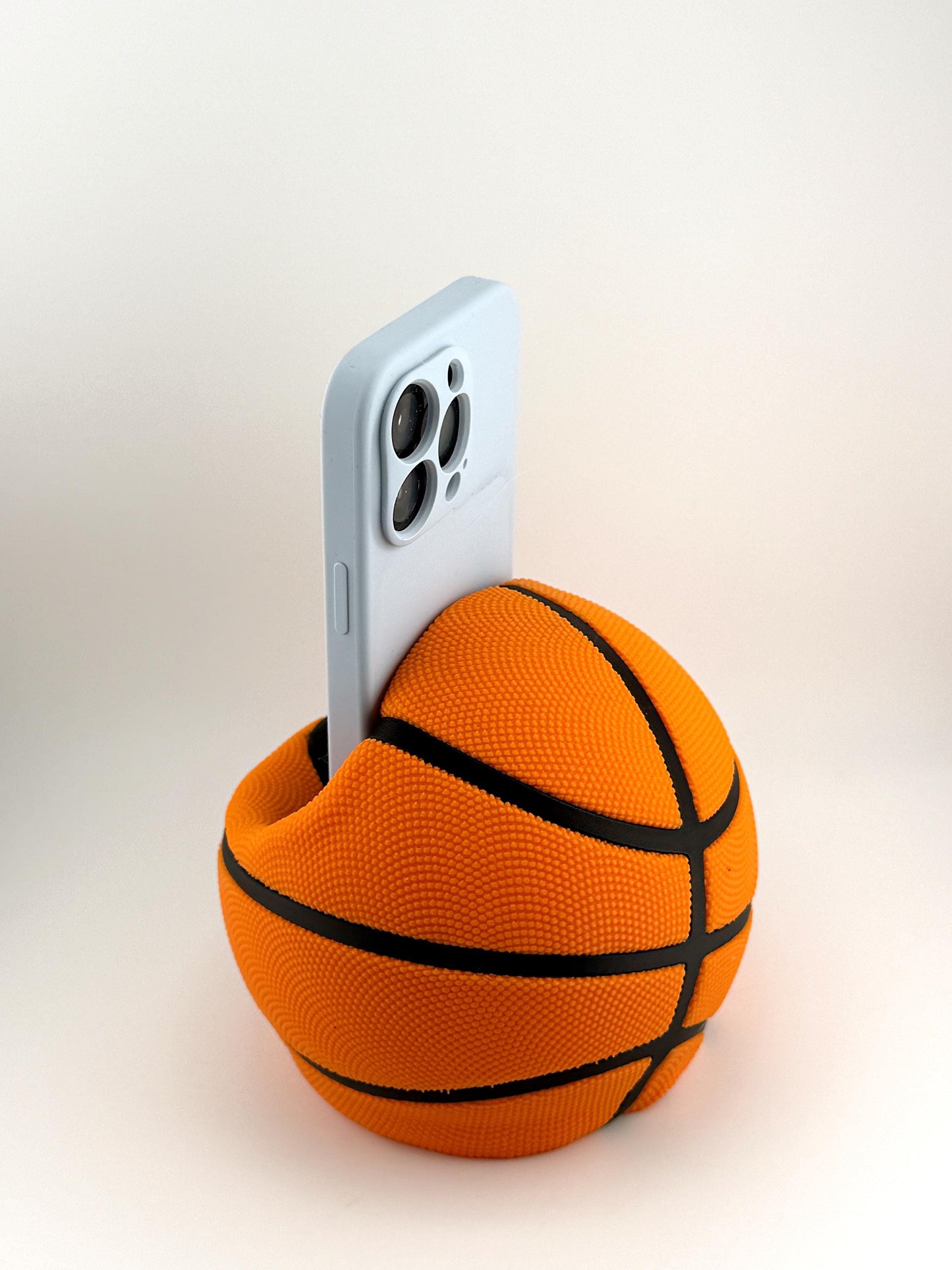 Basketball Slam Dunk Phone Holder and Charging Stand with Black Seams and Hidden Charging Cord Holder