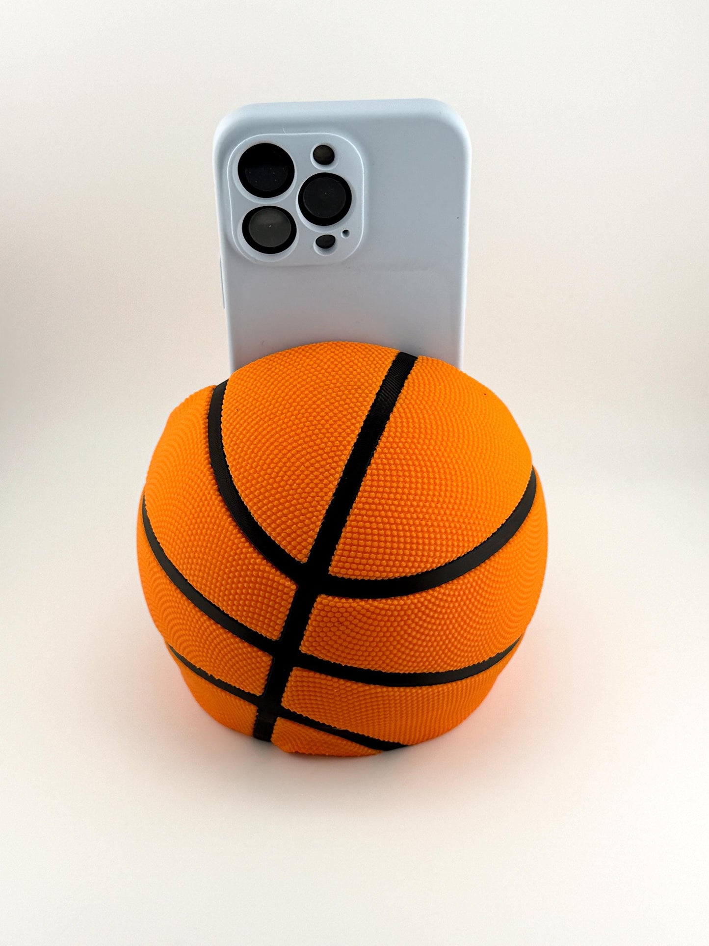 Basketball Slam Dunk Phone Holder and Charging Stand with Black Seams and Hidden Charging Cord Holder